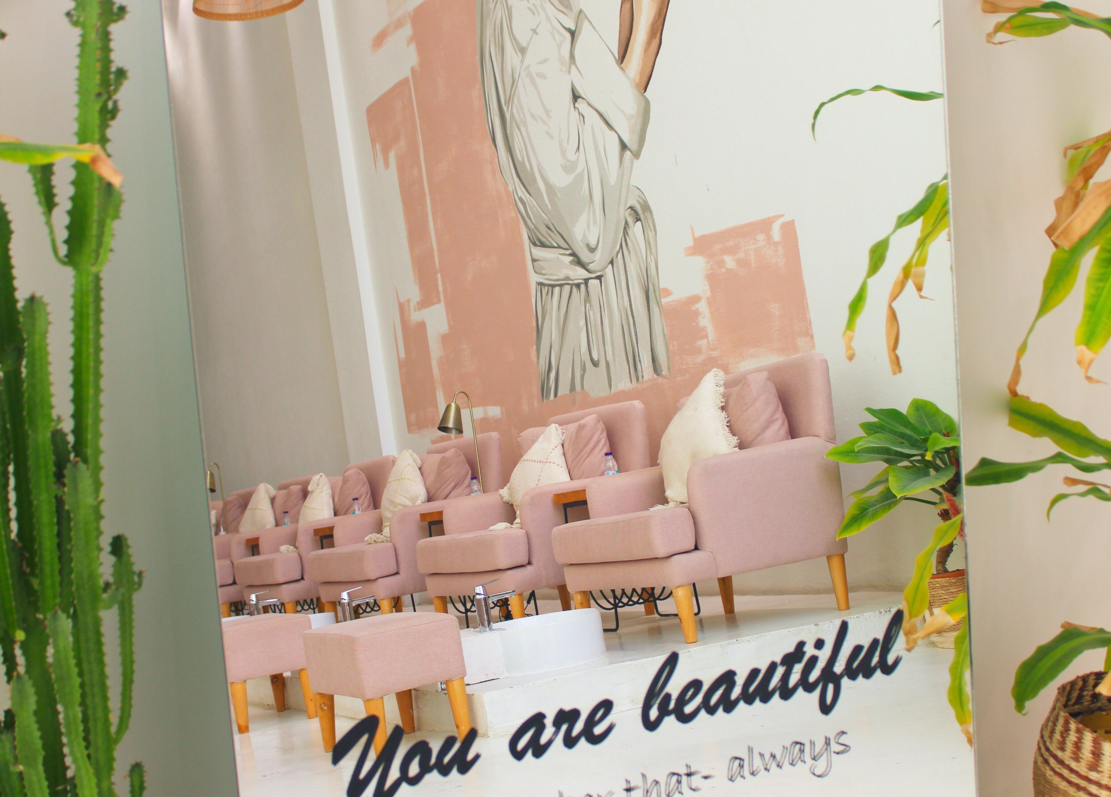 Elegant pink chairs at Nash ناش salon in Riyadh, Riyadh Province, SA, offer a beautiful, relaxing atmosphere.