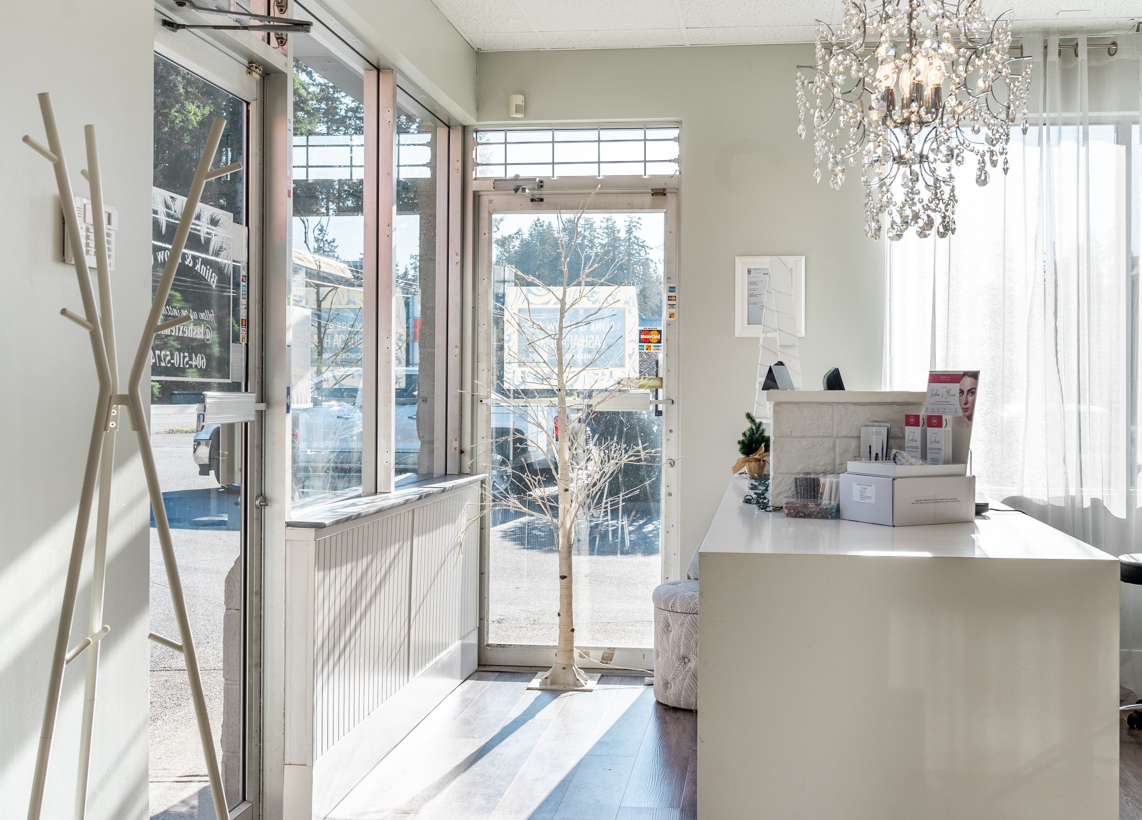 Bright, welcoming lobby of Blink & Brow Co. BROOKSWOOD in Langley Township, British Columbia, CA with elegant decor.