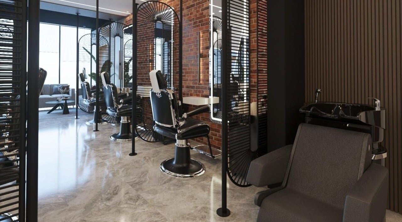 Modern interior of Pointcut Barbershop in Riyadh, featuring sleek barber chairs and chic decor.