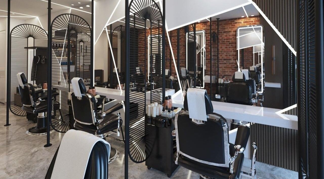 Modern interior of Pointcut Barbershop, Riyadh, showing sleek barber chairs and stylish decor.