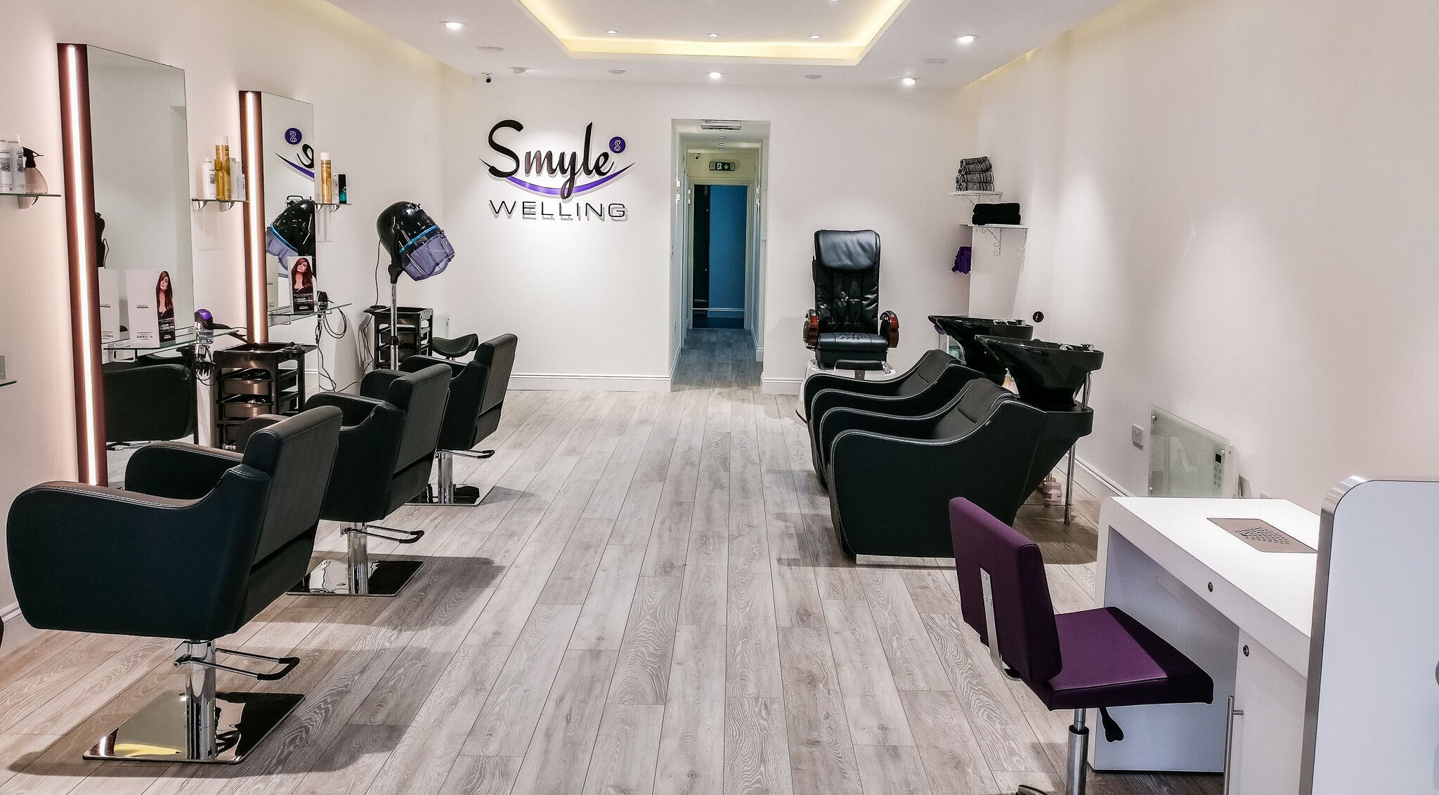 Elegant interior of Smyle Hair and Beauty at Welling, Welling, England, GB featuring modern styling chairs.