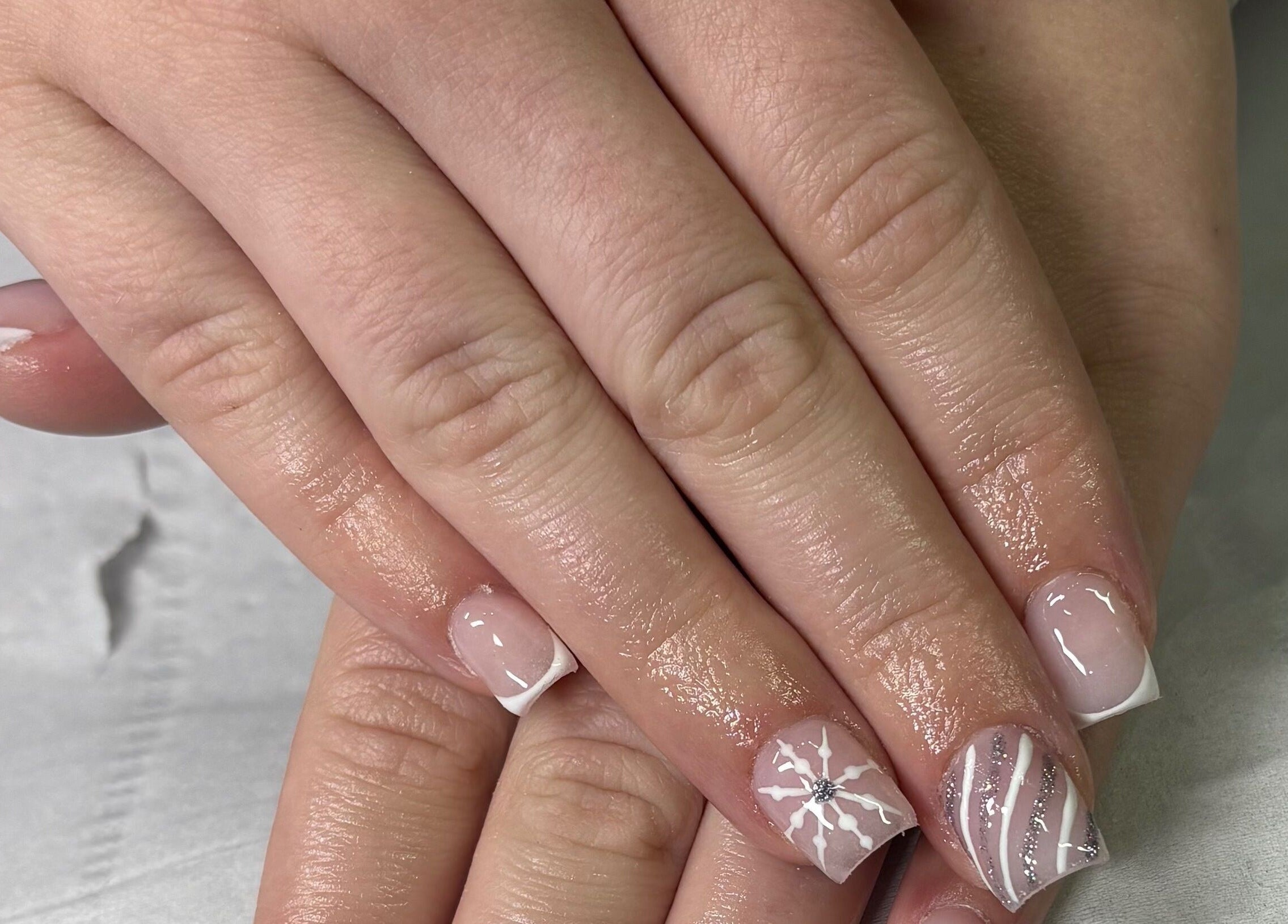 Detailed nail art at Megs Beauty Bar, Little Lever, England, GB showcasing intricate white designs.