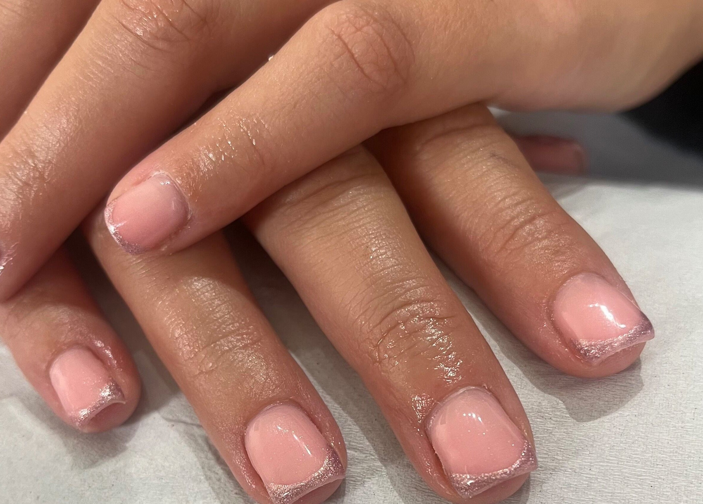 Stylish pink manicure at Megs Beauty Bar, Little Lever, England, GB showcasing expert nail art.