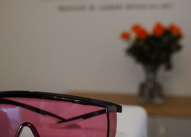 Protective pink visor at Love T Waxing and Laser Specialist Studio, Mansfield, England, GB with floral decor.