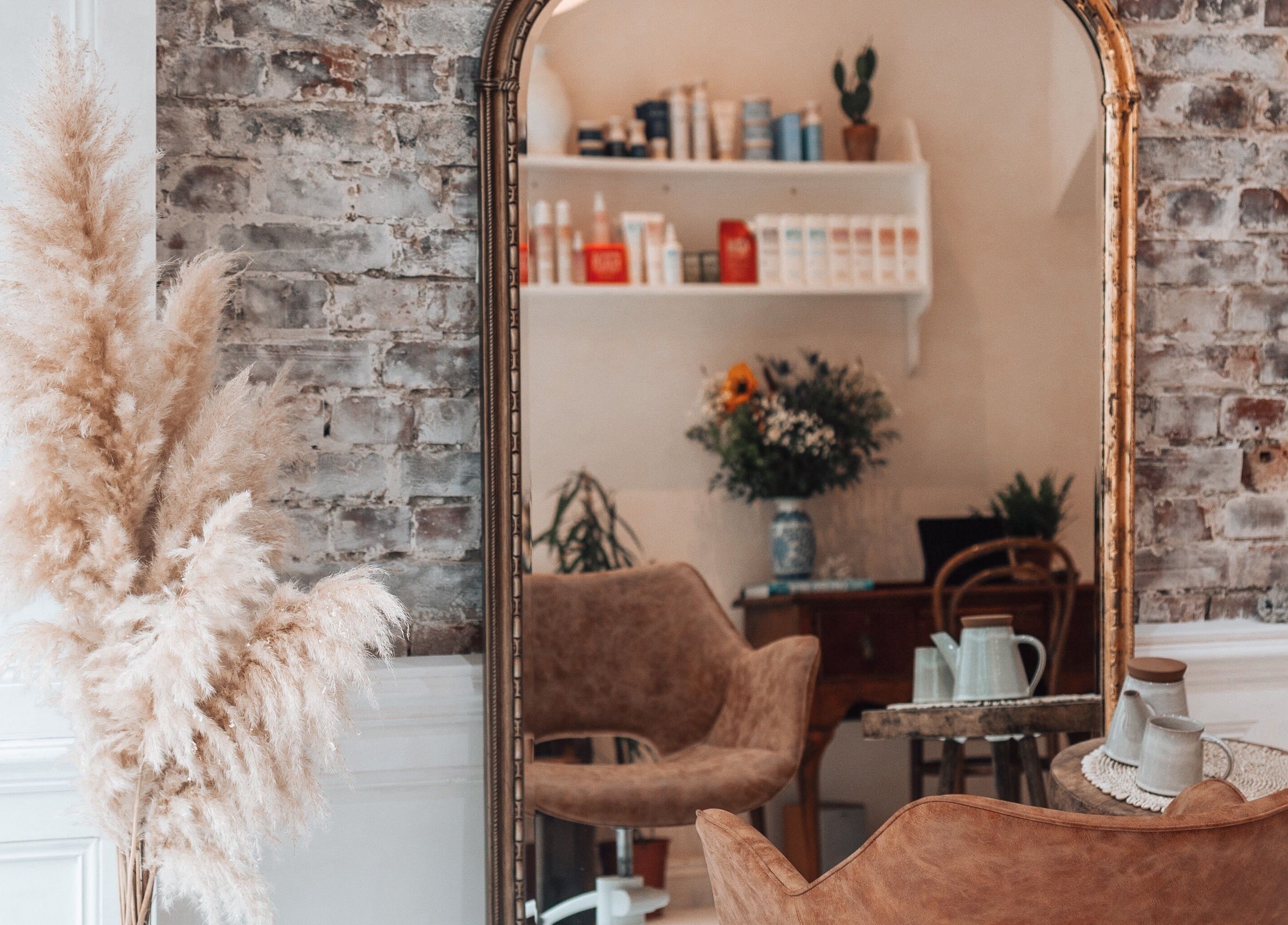 Chic interior of Morgelyn Studio in Penzance, England with vintage decor and plush seating.