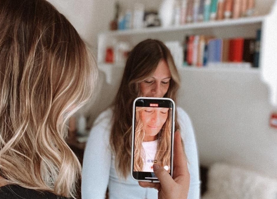 Client's hair and phone snapshot at Morgelyn Studio in Penzance, England, GB.