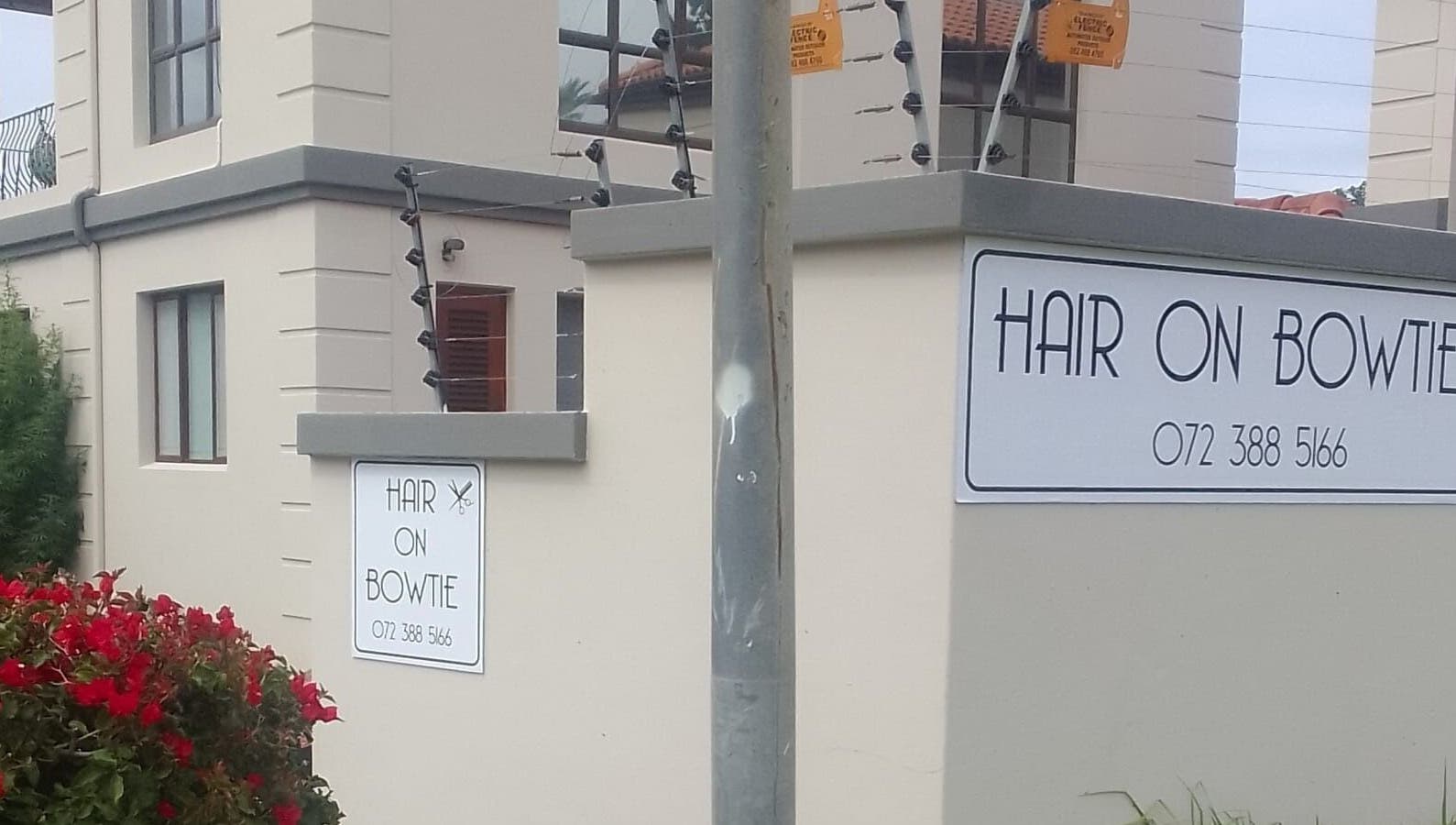 Entrance sign of Hair on Bowtie salon in Plettenberg Bay, Western Cape, ZA offering premium beauty services.