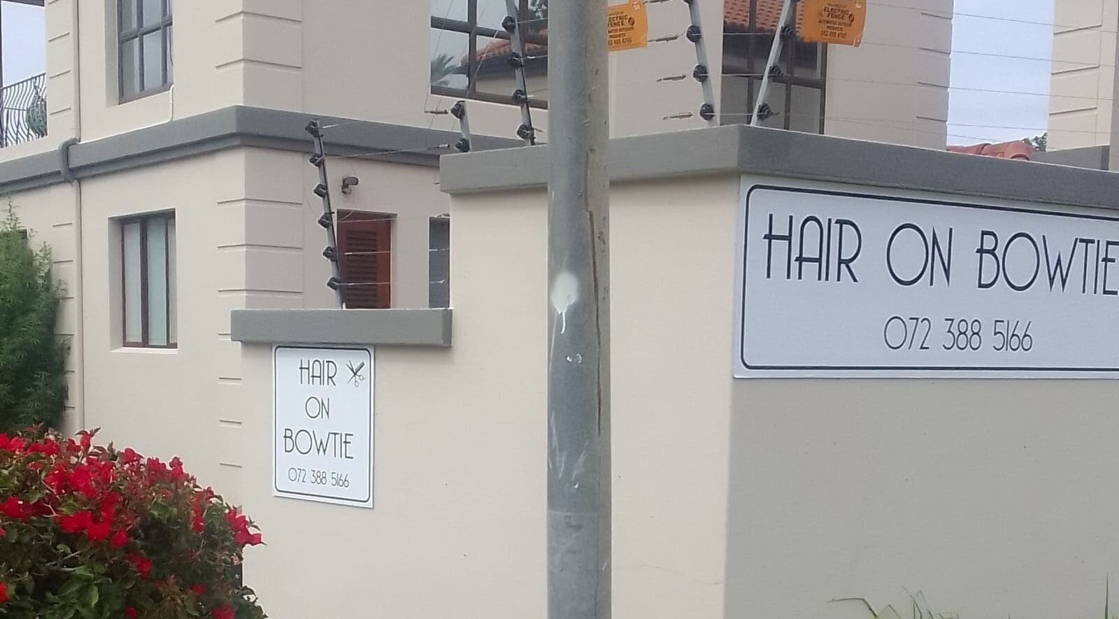 Entrance sign of Hair on Bowtie salon in Plettenberg Bay, Western Cape, ZA offering premium beauty services.