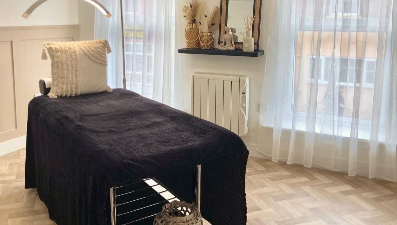 Calm treatment room at SW Beauty, Stoke-on-Trent, England, GB, with cozy decor and soft lighting.