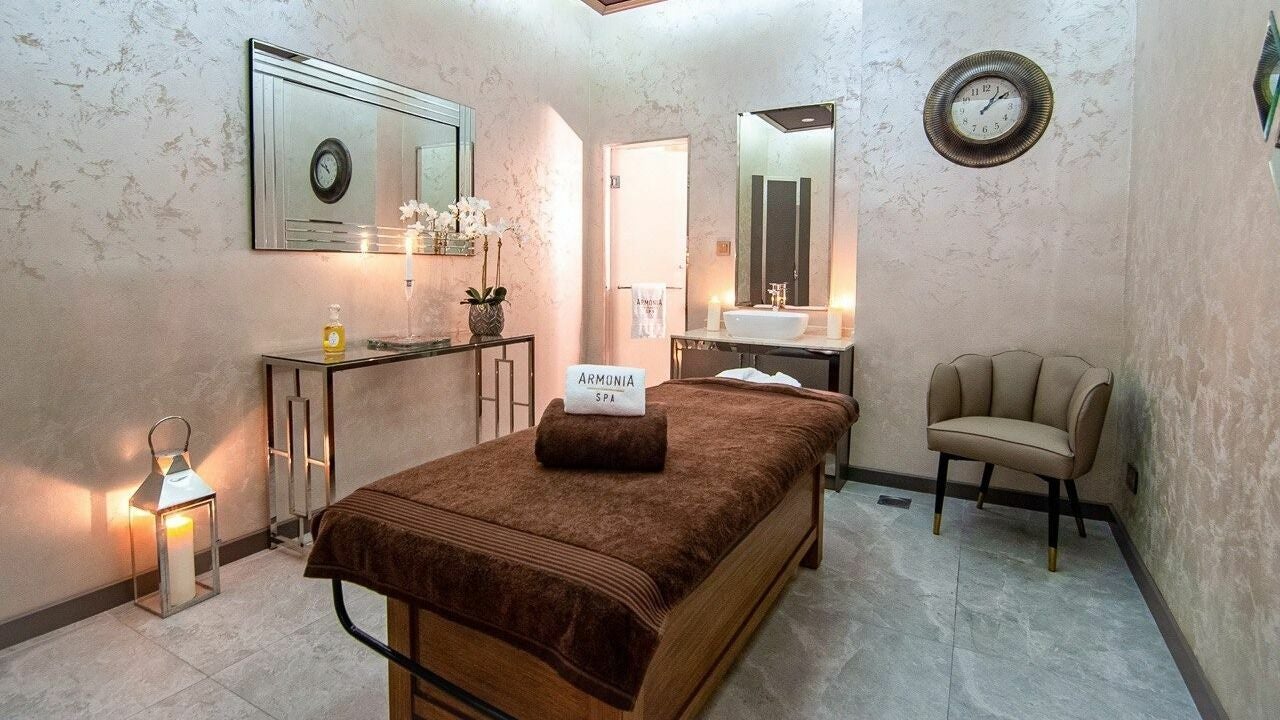 Relaxing massage room at Armonia Spa, La Suite Hotel & Apartments, Dubai, AE, featuring a tranquil ambiance.