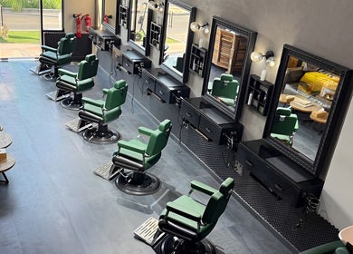 Modern salon interior at Project Hairway - Jumeirah, Dubai, Dubai, AE with stylish green chairs and mirrors.