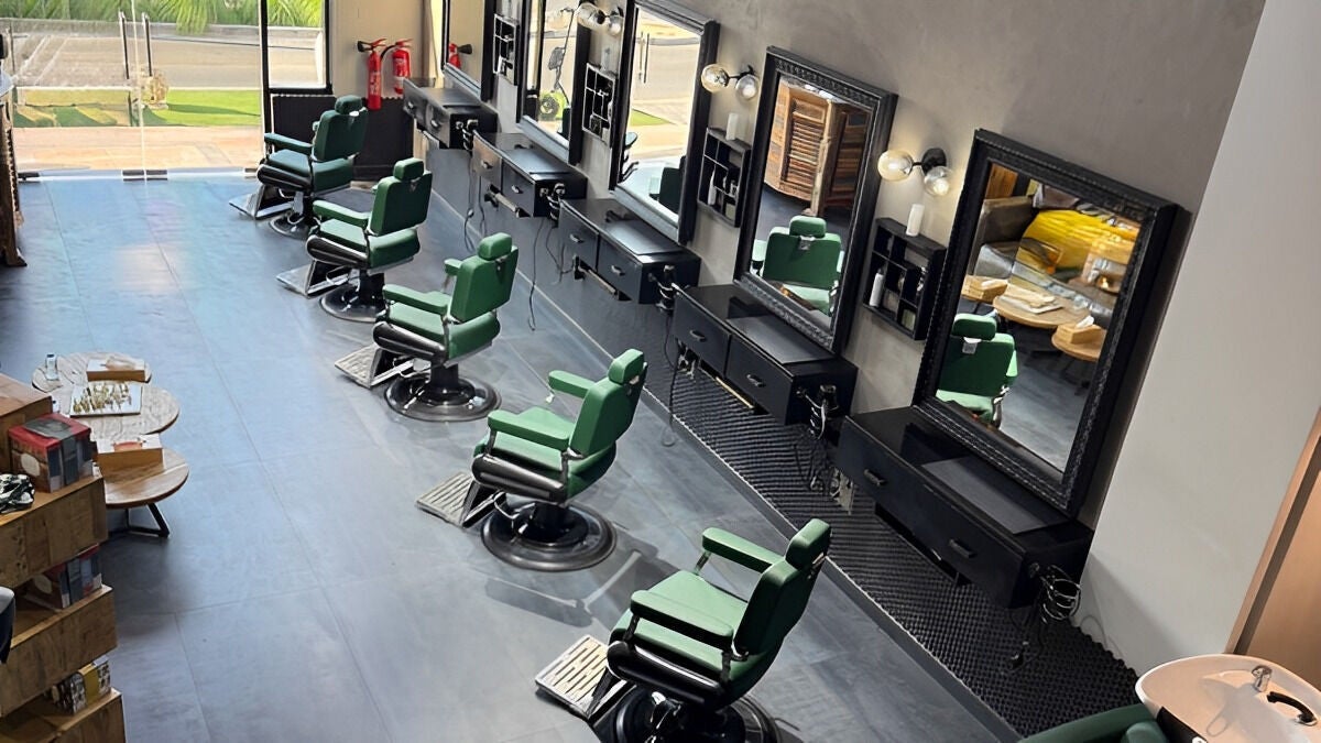 Modern salon interior at Project Hairway - Jumeirah, Dubai, Dubai, AE with stylish green chairs and mirrors.