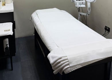Treatment room at Project Hairway - Jumeirah in Dubai, Dubai, AE featuring a spa bed with white linens.
