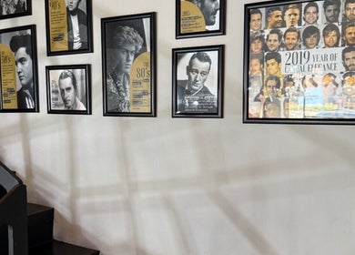 Framed celebrity portraits on the wall at Project Hairway - Jumeirah, Dubai, Dubai, AE.