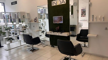 Modern salon interior at Christine's Beauty, Puerto del Rosario, Canarias, ES, featuring sleek chairs and decor.