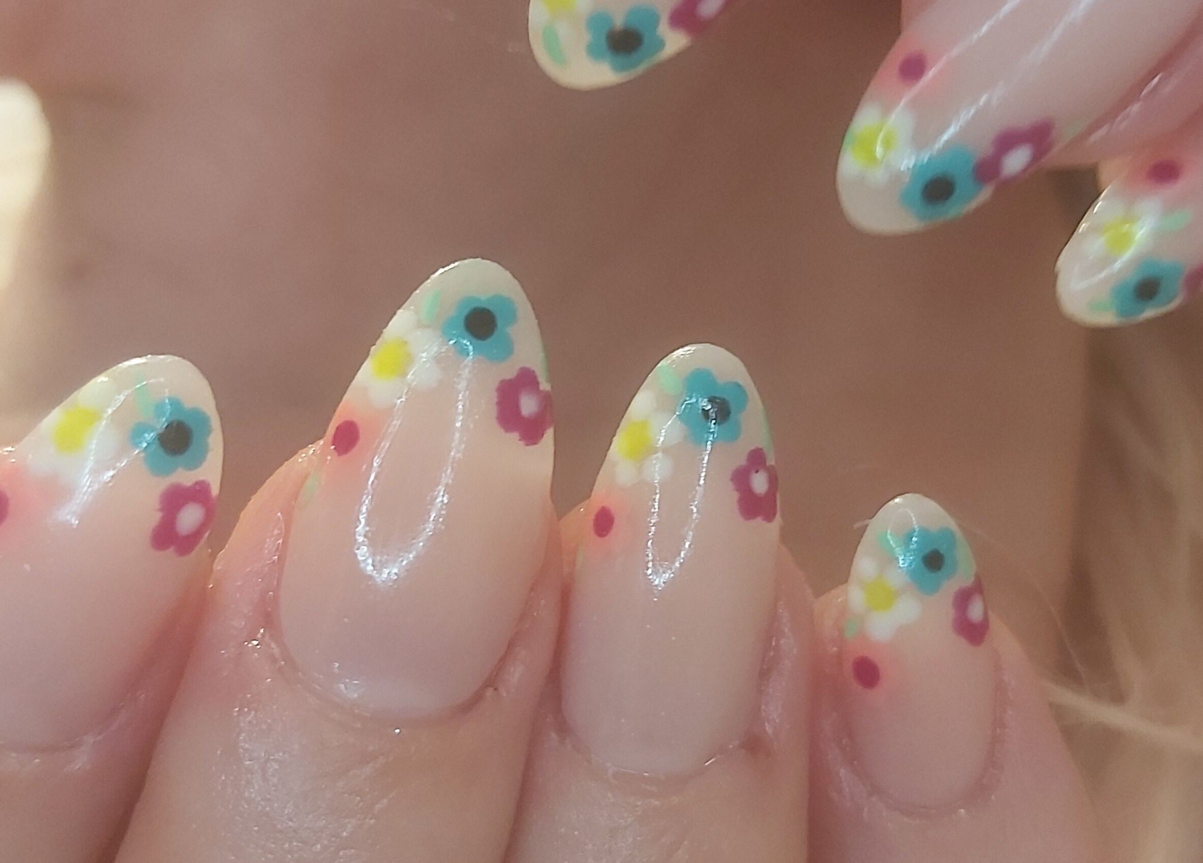 Colorful flower nail art at Tips To Toes Cabin, Holmewood, England, GB. Perfect for stylish manicures.