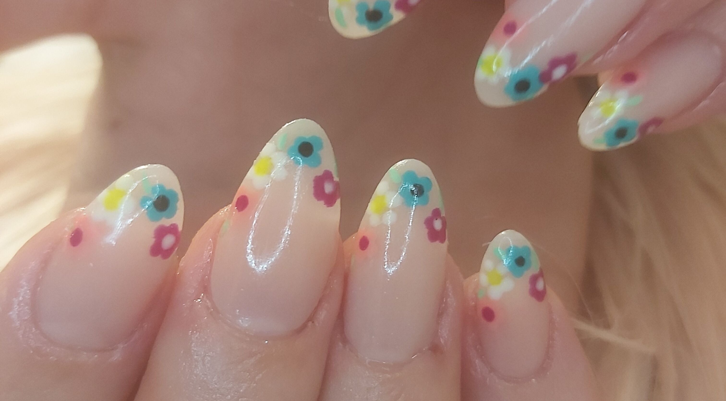 Colorful flower nail art at Tips To Toes Cabin, Holmewood, England, GB. Perfect for stylish manicures.