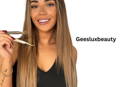 Woman smiling and holding tweezers at GeesLuxBeauty, Huntingdale, Western Australia, AU.