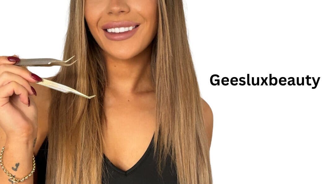Woman smiling and holding tweezers at GeesLuxBeauty, Huntingdale, Western Australia, AU.
