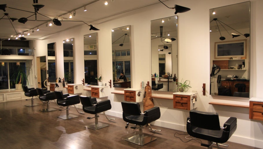 Elegant salon interior at David James San Francisco, featuring modern styling stations. Located in San Francisco, California, US.