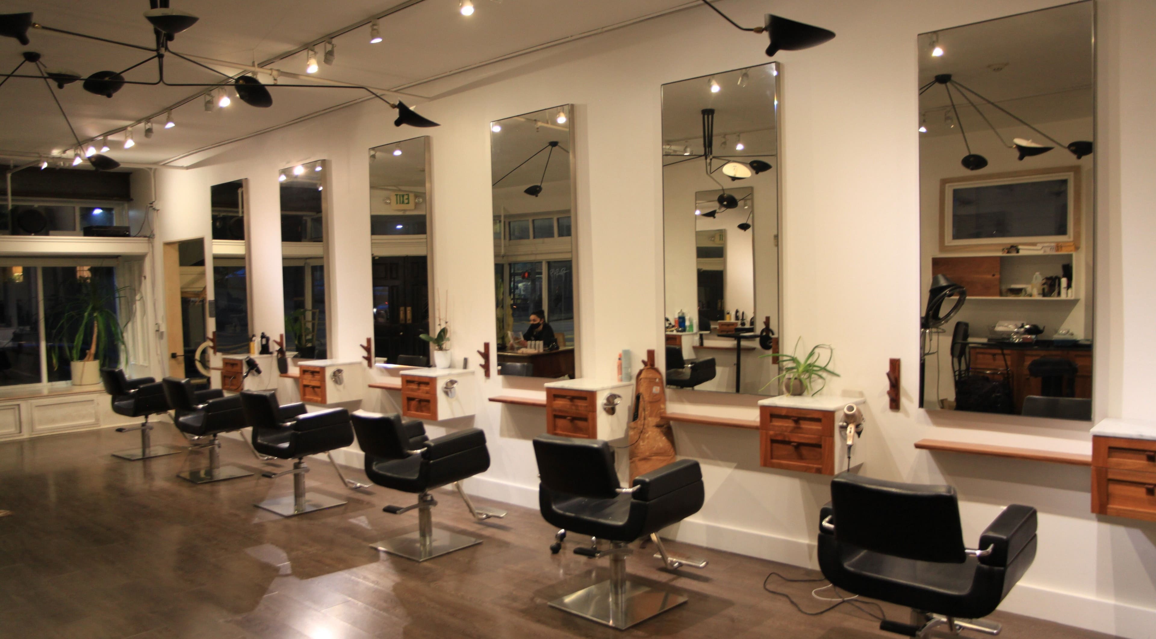 Elegant salon interior at David James San Francisco, featuring modern styling stations. Located in San Francisco, California, US.