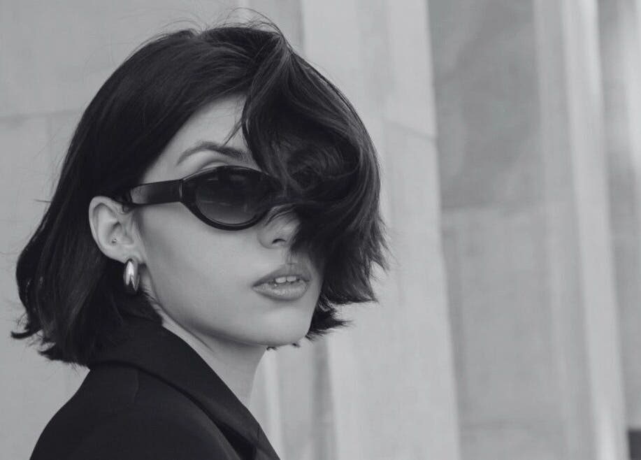 Stylish woman in black sunglasses at David James San Francisco, San Francisco, California, US.