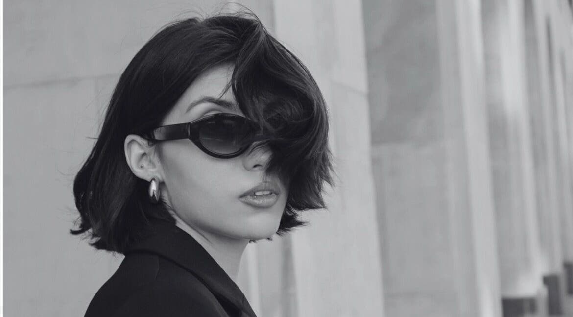 Stylish woman in black sunglasses at David James San Francisco, San Francisco, California, US.