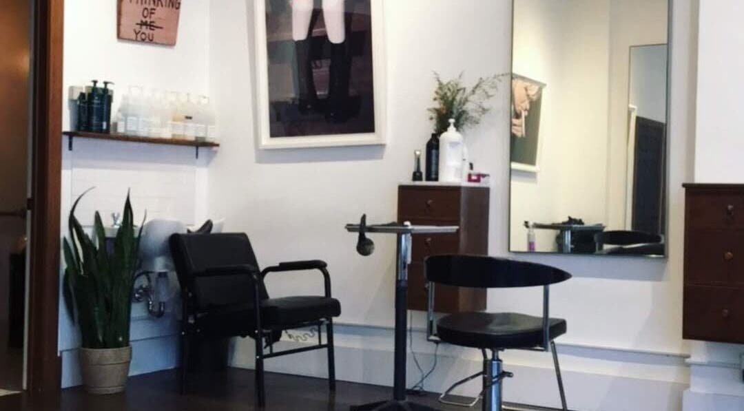 Stylish salon seating at David James | Marin, San Rafael, California, US with modern decor and a large mirror.