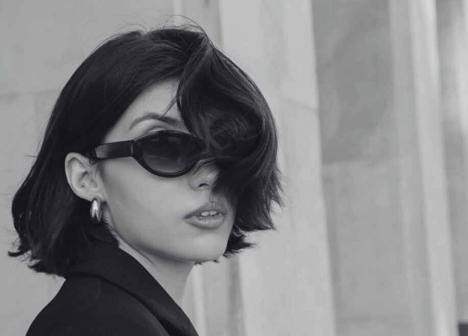 Stylish woman in sunglasses at David James | Marin, San Rafael, California, US showcasing modern elegance.