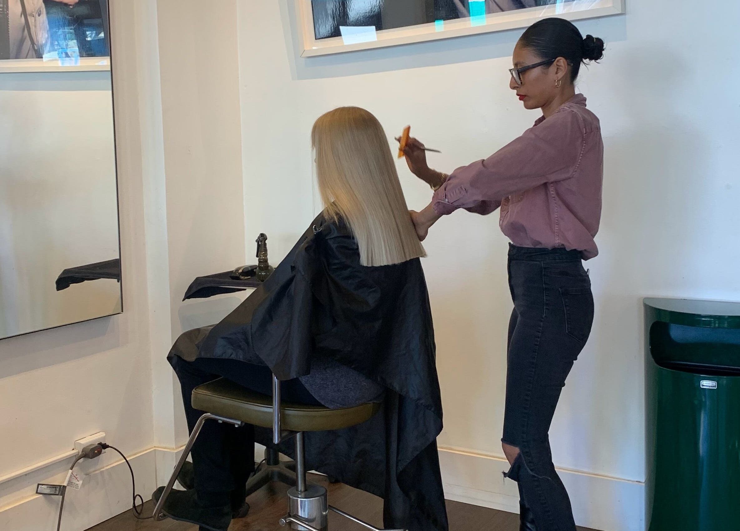 Expert haircut at David James | Marin in San Rafael, California, US. Hairstylist perfects a sleek, blonde look.