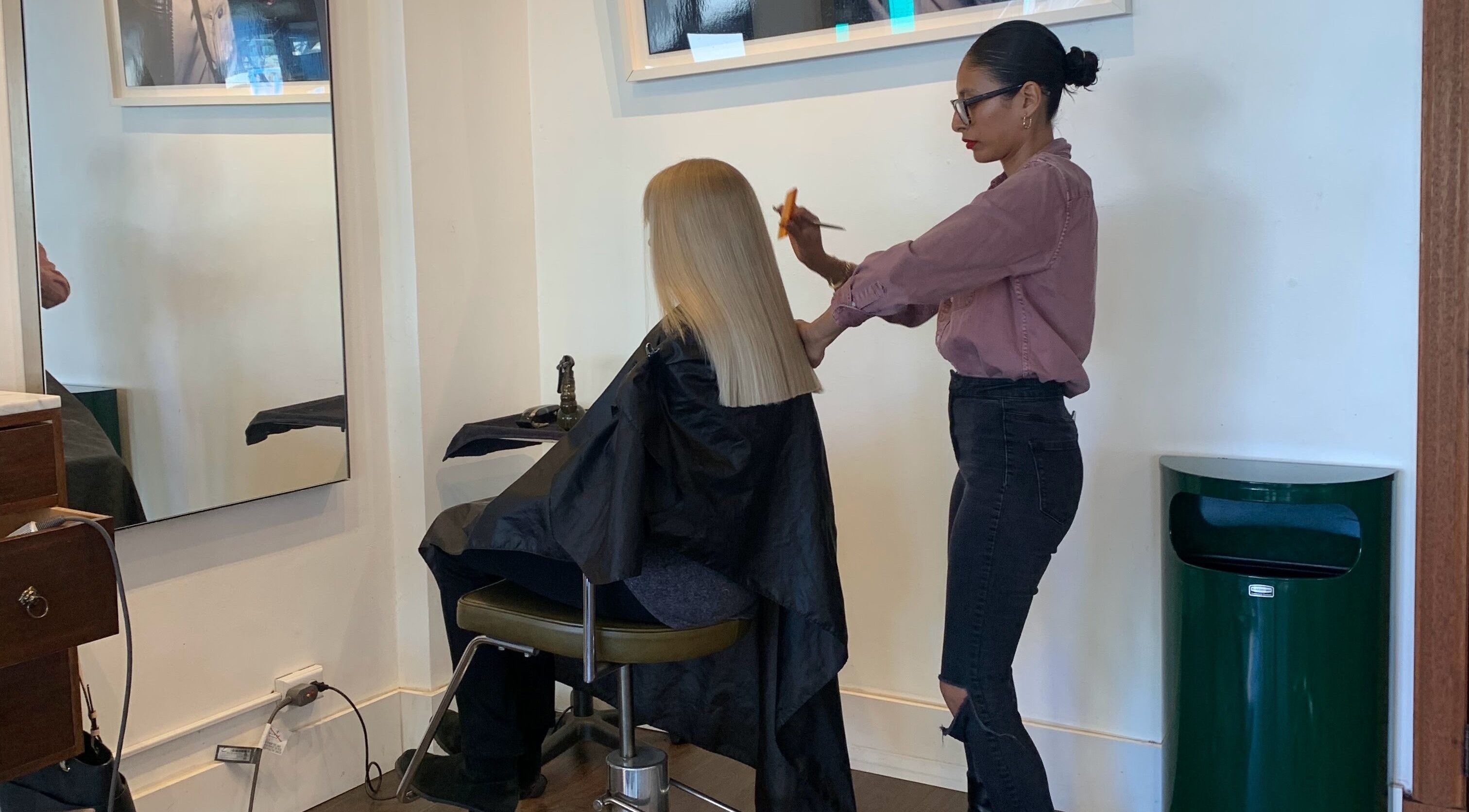 Expert haircut at David James | Marin in San Rafael, California, US. Hairstylist perfects a sleek, blonde look.