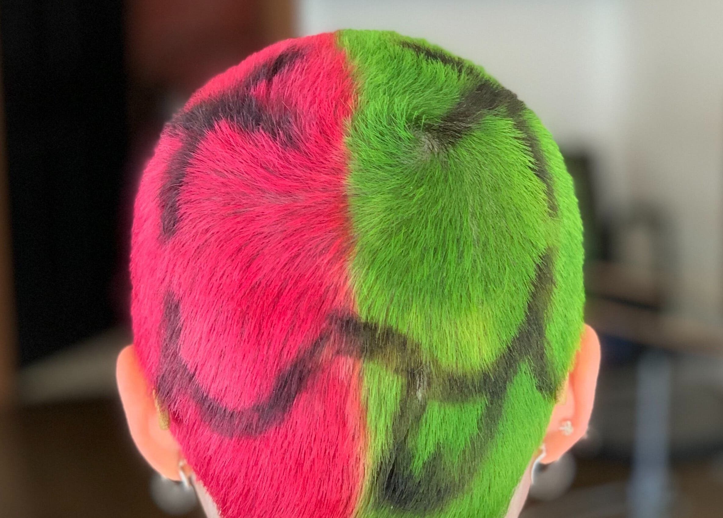 Vibrant red and green split hair design at David James | Marin, San Rafael, California, US.