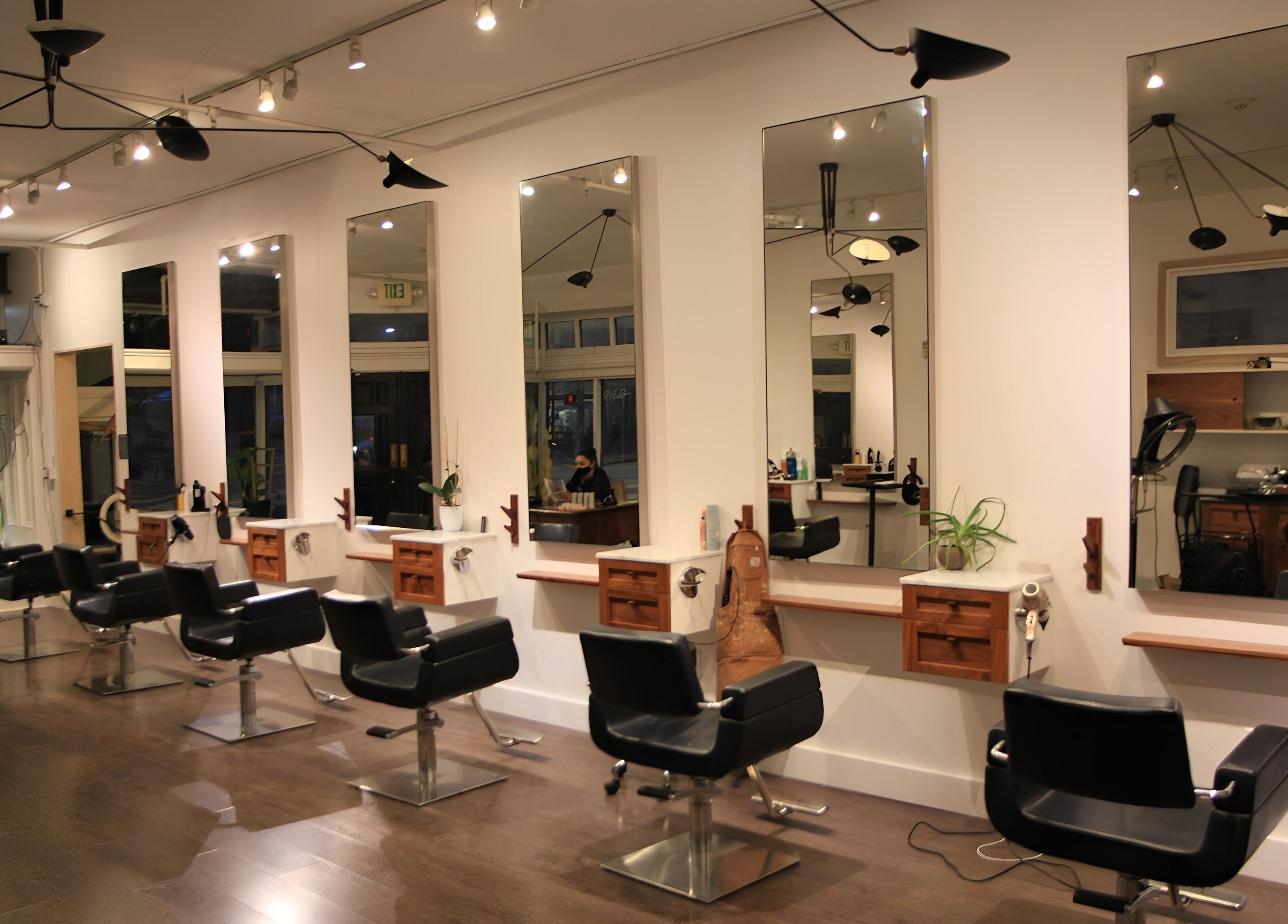 Modern salon interior with styling stations at David James San Francisco in San Francisco, California, US.