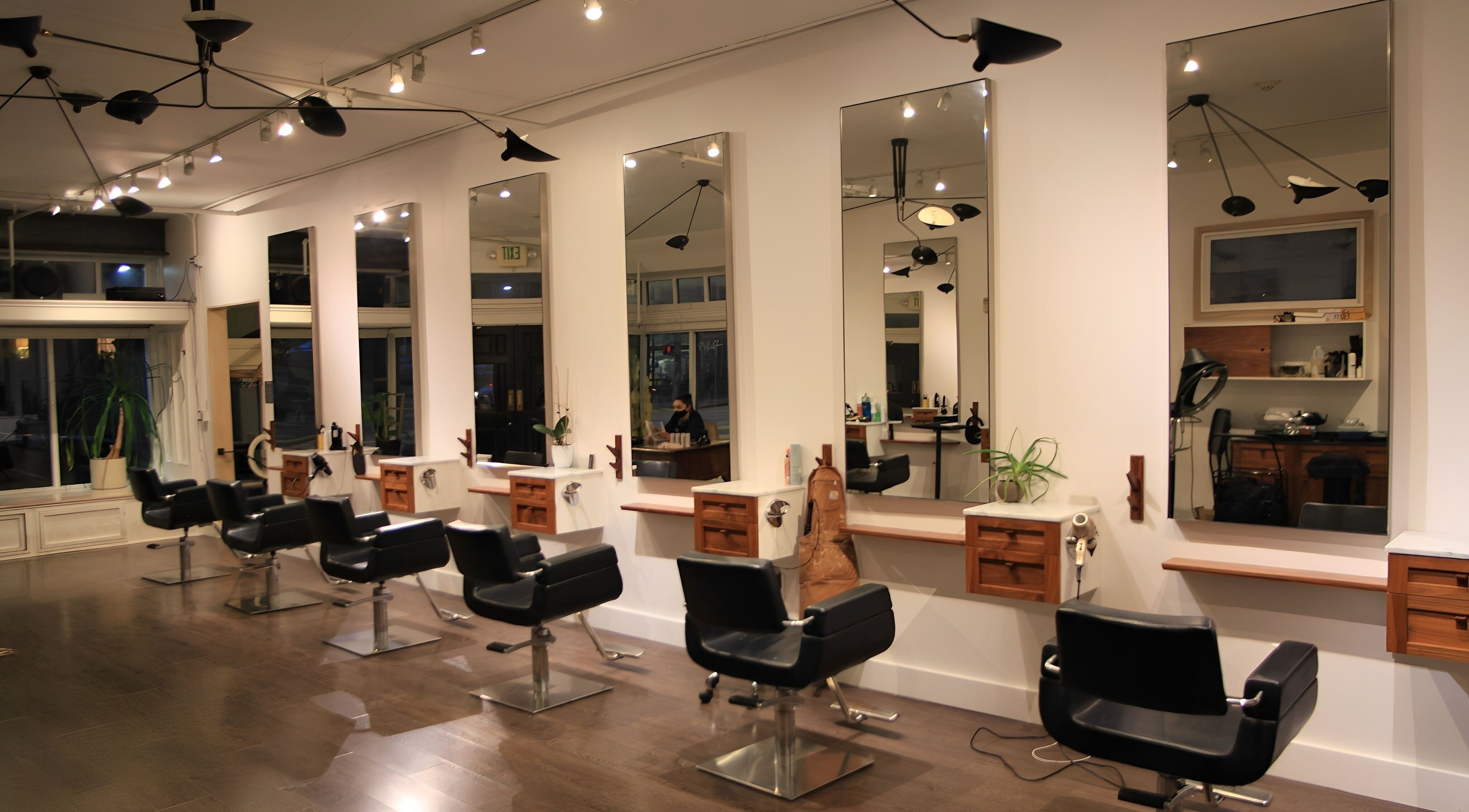 Modern salon interior with styling stations at David James San Francisco in San Francisco, California, US.
