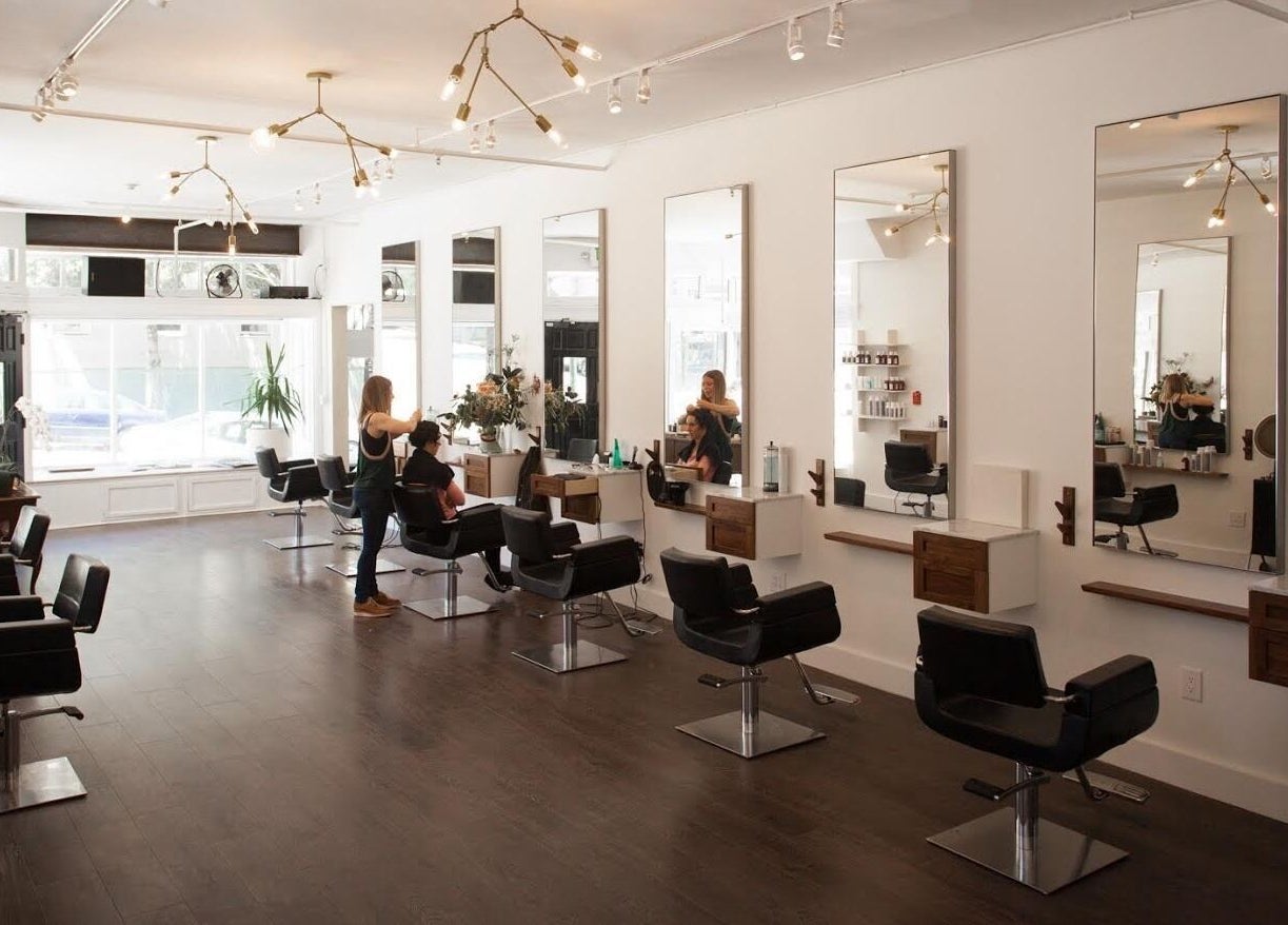 Interior of David James San Francisco salon, featuring modern styling chairs. Location: San Francisco, California, US.