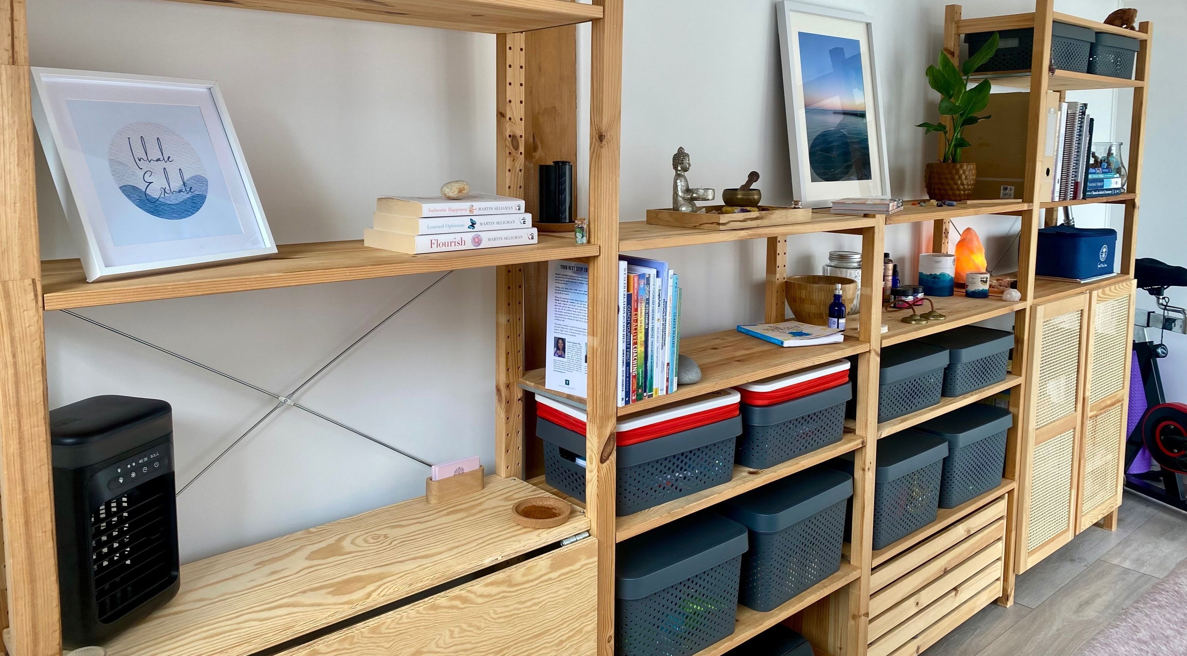 Wooden shelves with books and decor at Balanced & Blissed - The Retreat, Whitfield, England, GB.