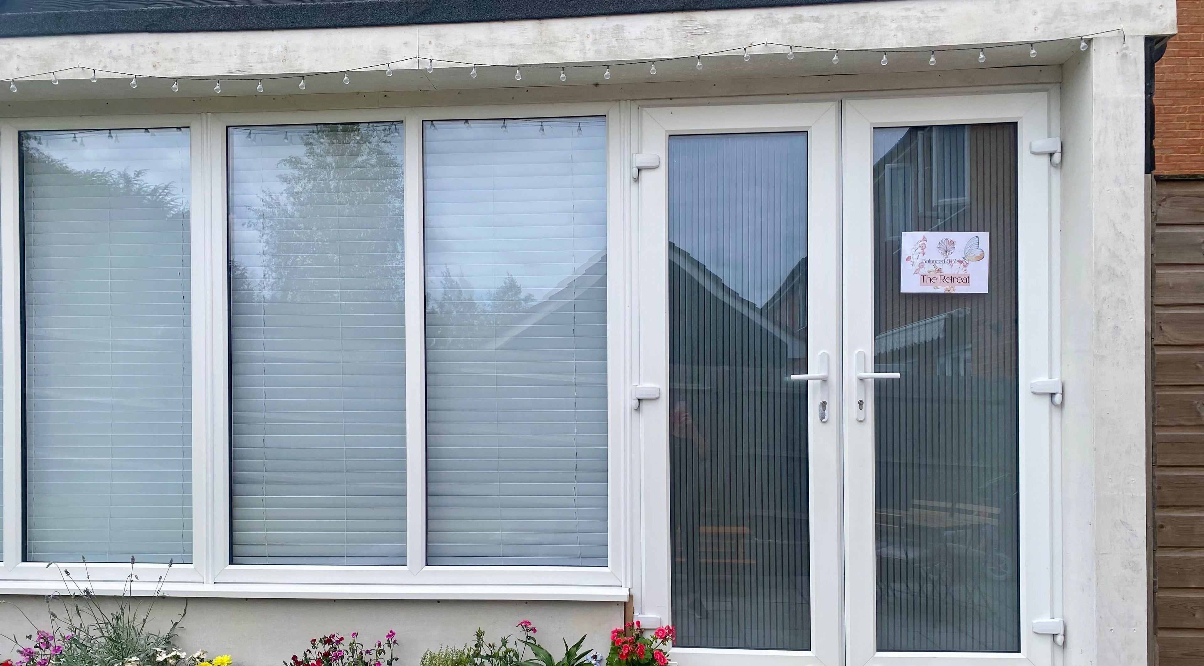 Front view of Balanced & Blissed - The Retreat in Whitfield, England, GB, showcasing inviting entrance decor.