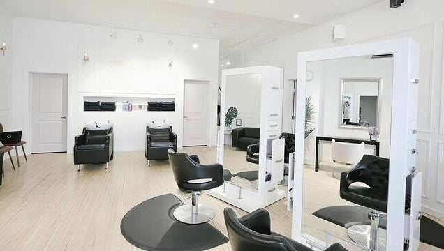 Modern salon chairs and mirrors at Posh & Pixie, Kenora, Ontario, CA inviting a luxurious experience.