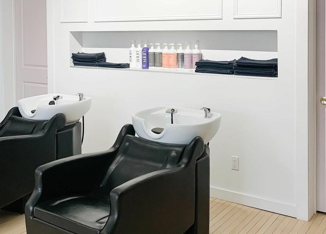 Modern shampoo stations at Posh & Pixie, Kenora, Ontario, CA offering luxurious hair care experience.