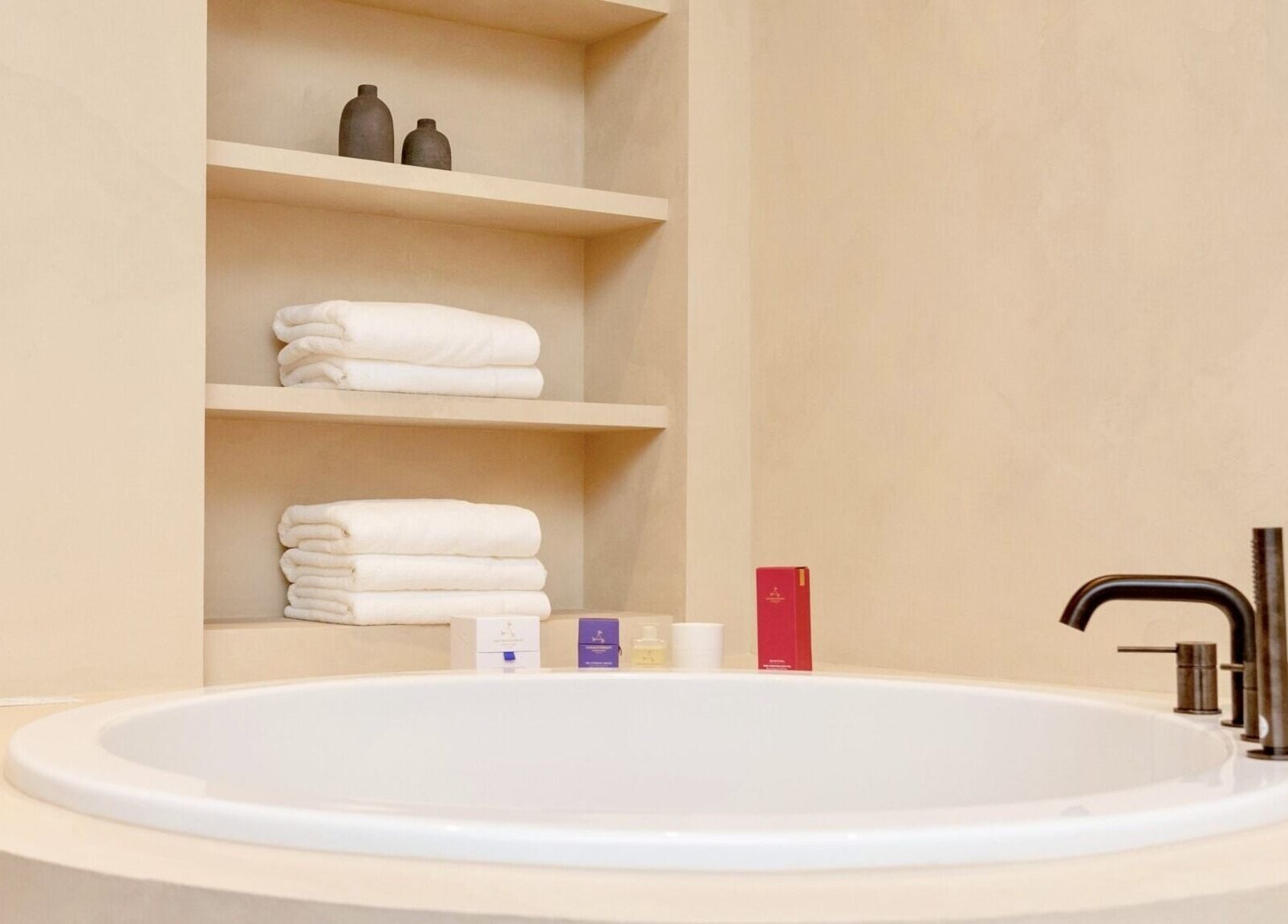 Luxurious spa bath and shelves at Pemberley Springs SPA EDEN, Toronto, Ontario, CA, embodying relaxation.