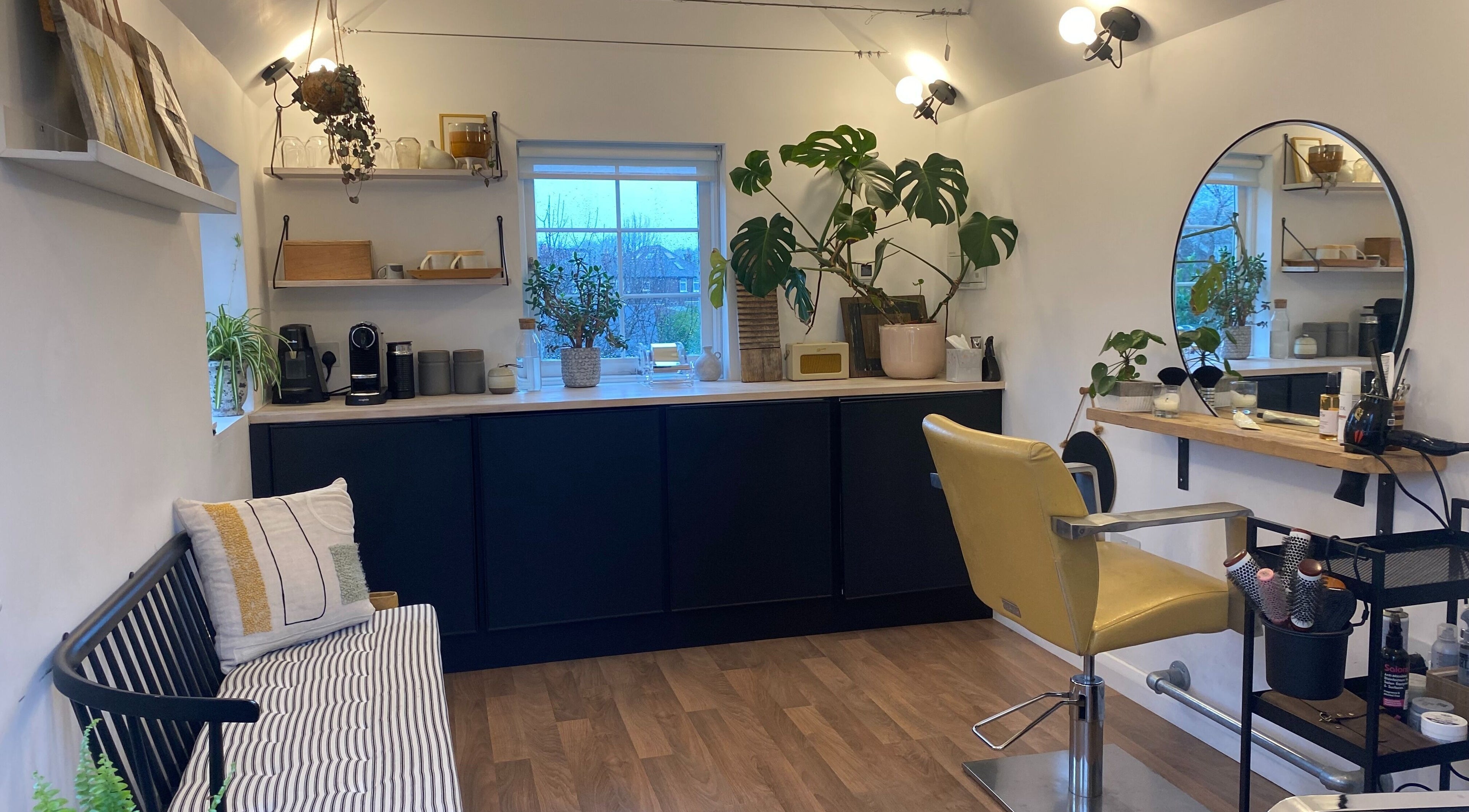 Modern salon interior of Victoria Smith Hair, Guildford, England, GB with stylish décor and seating area.
