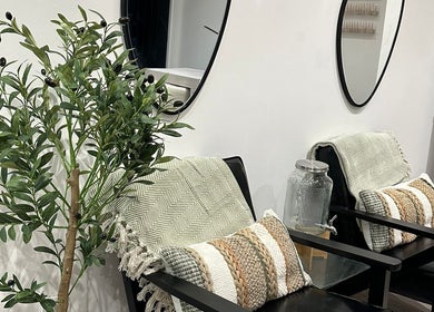 Cozy seating area with plants and cushions at Aaliyahbrookesbeauty, Telford, England, GB.