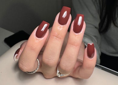 Stylish red manicure at Aaliyahbrookesbeauty, Telford, England, GB showcases chic nail art.