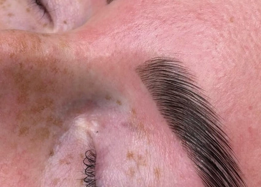 Close-up of expertly shaped eyebrow at Urban Brows West, Edmonton, Alberta, CA, highlighting precision.