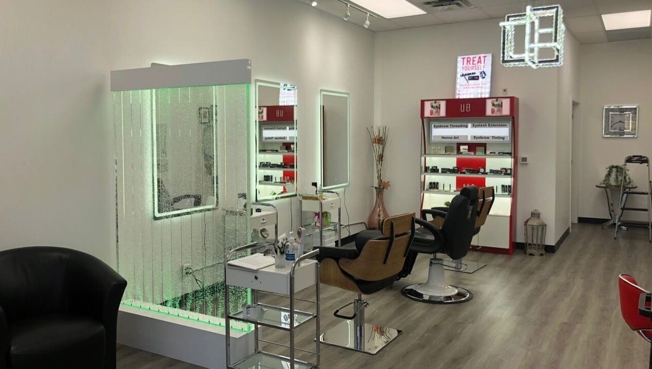 Interior view of Urban Brows Beaumont showing modern styling chairs and beauty products in Beaumont, Alberta, CA.