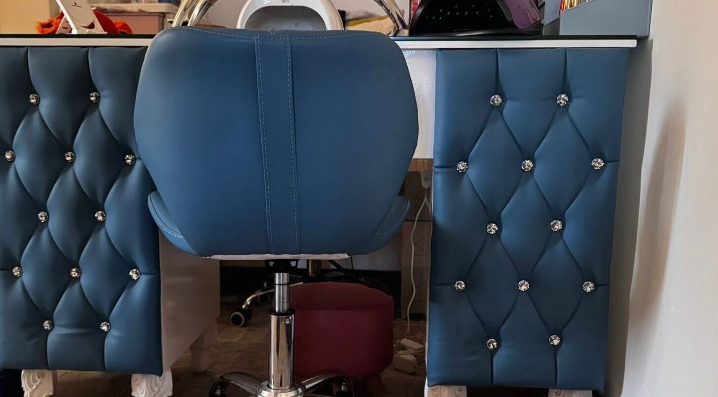 Lux Beauty Studio x Nae in Holetown, Saint James, BB features a plush blue styling chair with crystal accents.