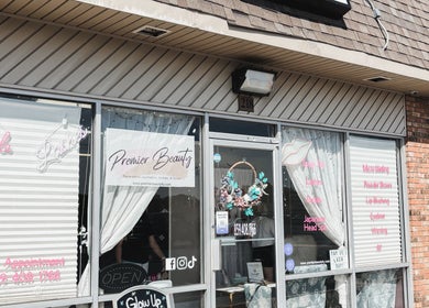 Exterior of Premier Beauty in Berea, Kentucky, US showcasing inviting entrance and stylish signage.