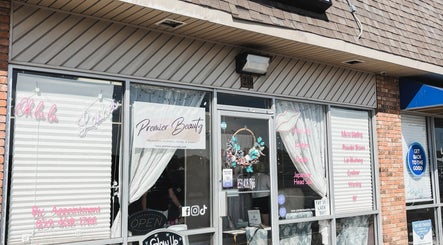 Exterior of Premier Beauty in Berea, Kentucky, US showcasing inviting entrance and stylish signage.