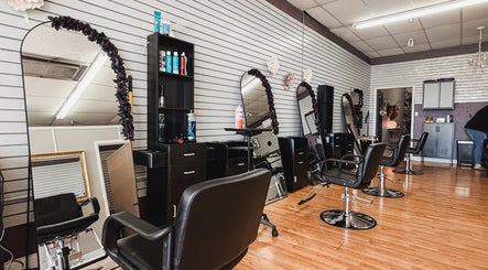 Interior of Premier Beauty in Berea, Kentucky, US with stylish salon chairs and mirrors.