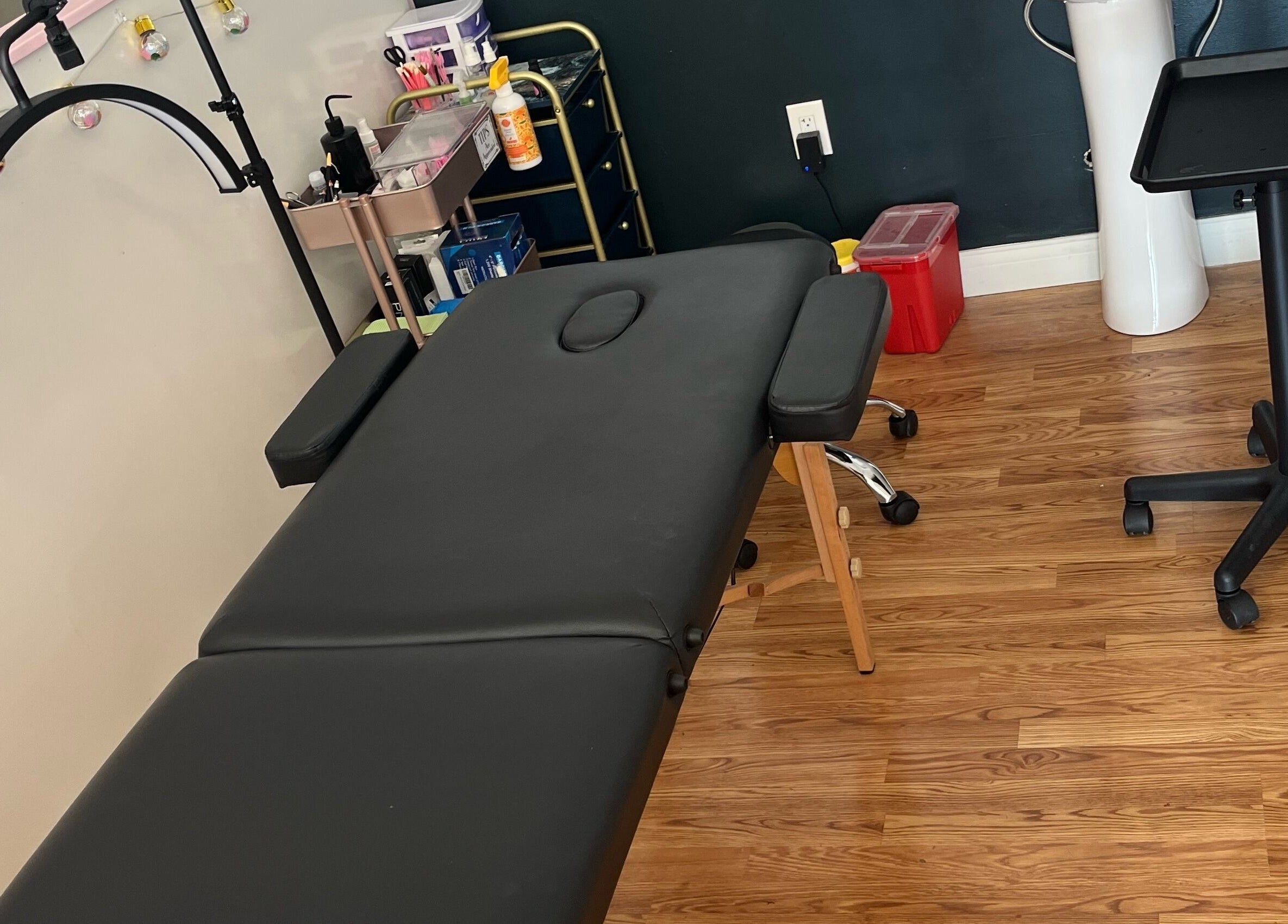 Relaxing treatment room at Premier Beauty in Berea. Modern decor and cozy massage table in Berea, Kentucky, US.